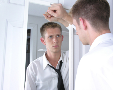 man-looking-into-mirror