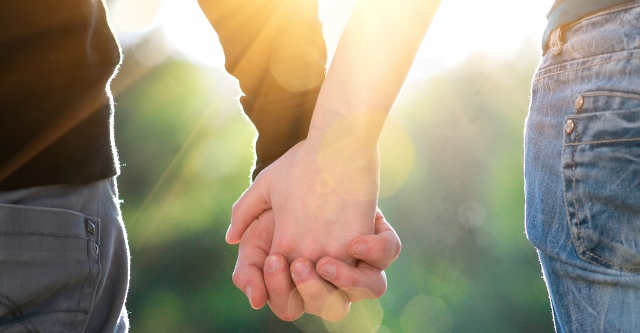 young-couple-holding-hands