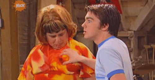 Friends act playfully insinuating the body fat