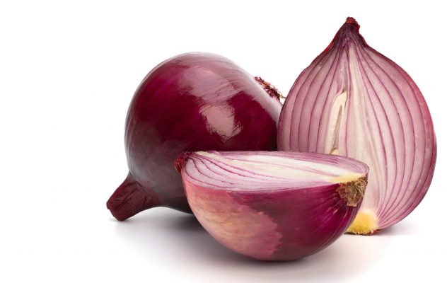 Red sliced onion isolated on white background